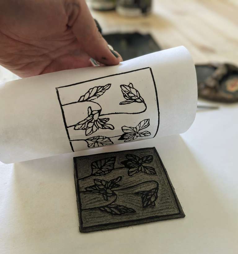 lino print being lifted of the block